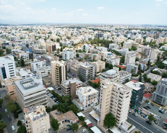 an aerial view of a city with tall buildings