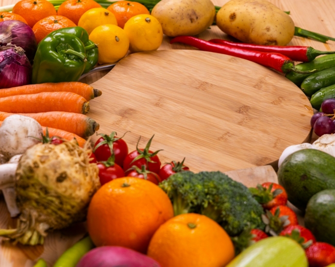 orange and green vegetables on brown wooden table