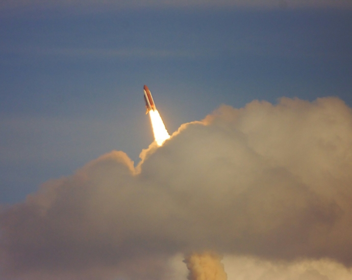 low-angle photography of red space shuttle