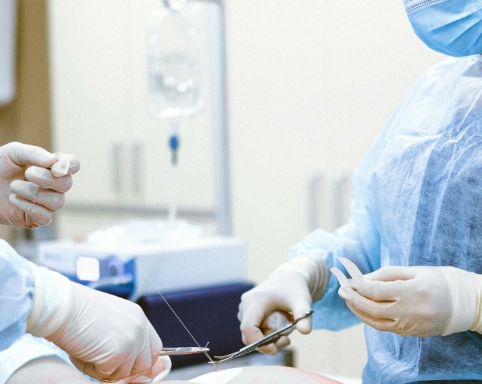 Photo of Medical Professionals Wearing Personal Protective Equipment