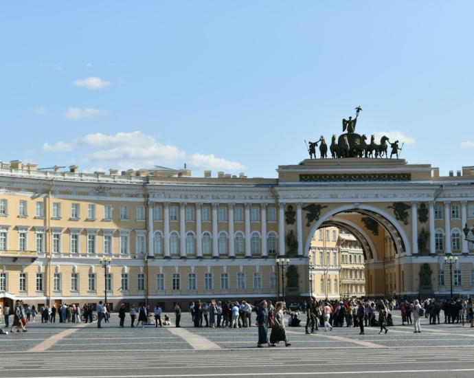 people walking near white concrete building during daytime