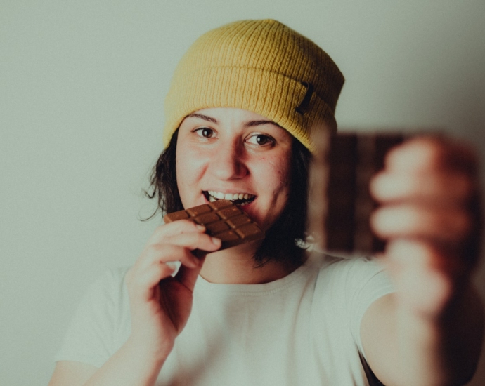 woman in white crew neck t-shirt wearing yellow knit cap