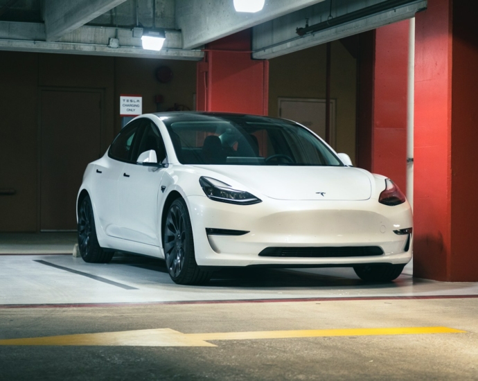 a white car parked in a parking garage