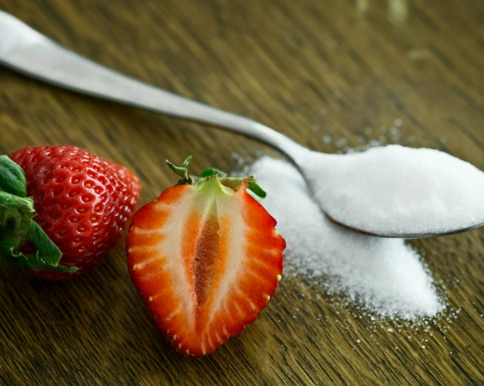 Strawberry Beside Spoon of Sugar