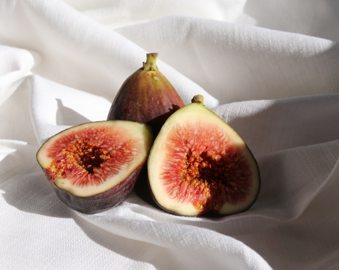 brown and green fruit on white textile