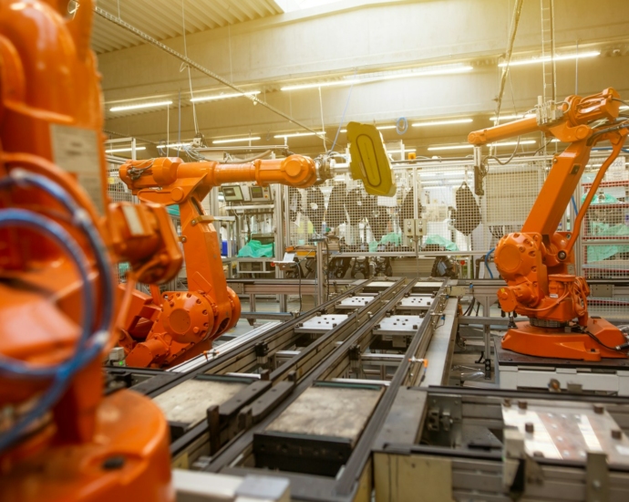 a factory filled with lots of orange machines