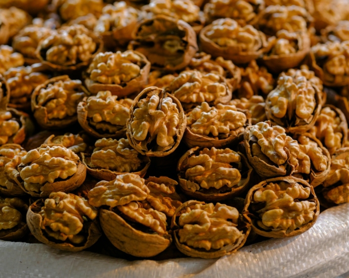 a pile of walnuts sitting on top of a table