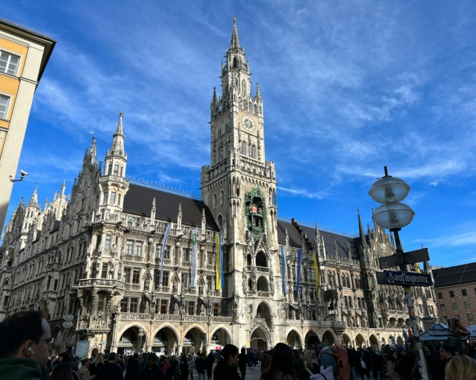 a group of people standing in front of a large building