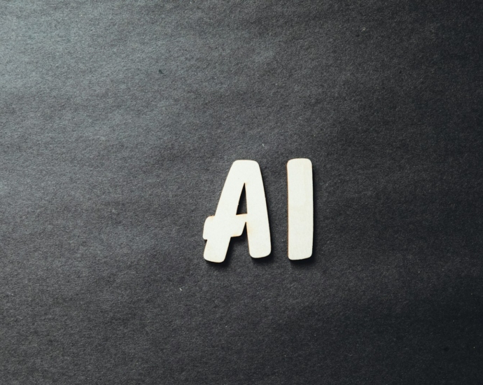 the word ai spelled in white letters on a black surface