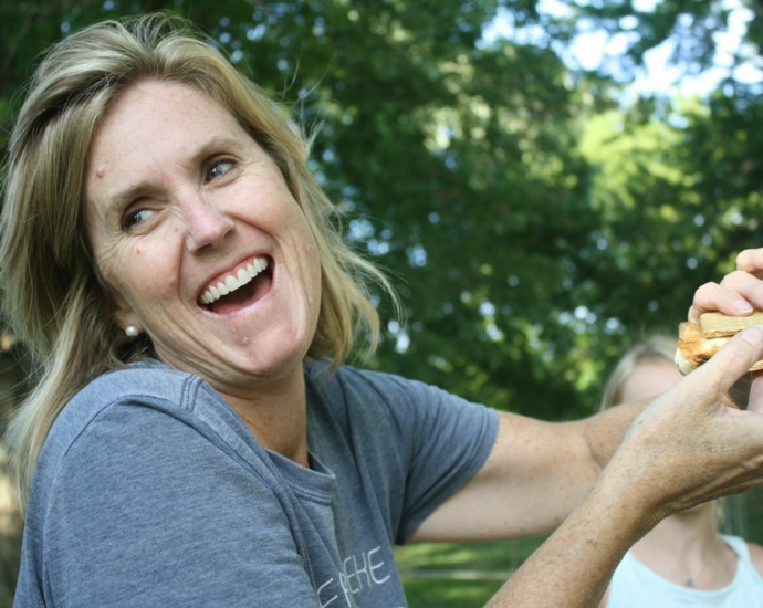 woman holding sandwich