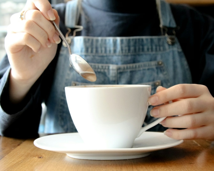 person having coffee during daytime