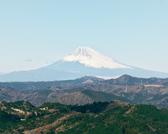 a view of a snow covered mountain in the distance