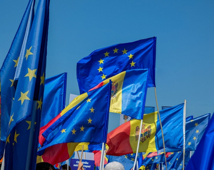 a bunch of flags that are flying in the air