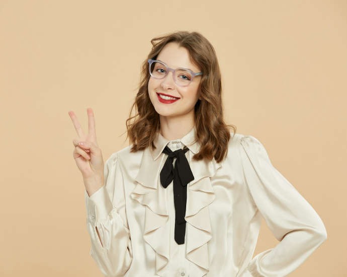 A woman in a white shirt and black tie