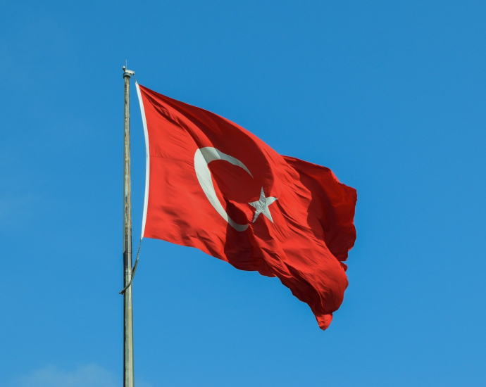 red and white national waving flag