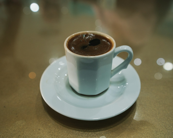 white ceramic mug on white ceramic saucer