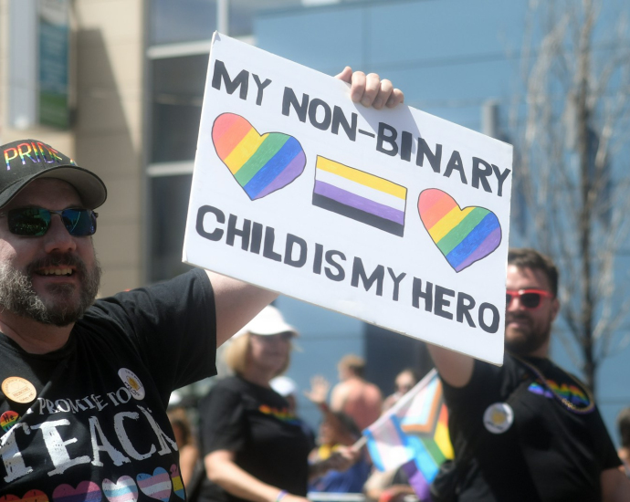 a man holding a sign