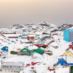 town on hill covered with snow