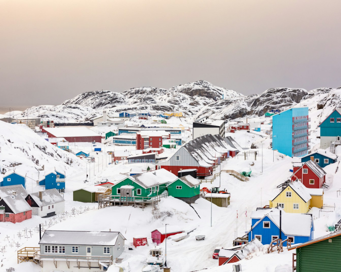 town on hill covered with snow