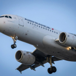 white passenger plane in the sky during daytime