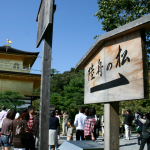 A group of people standing in front of a building