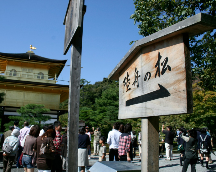 A group of people standing in front of a building