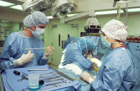 people in blue scrub suit sitting on chair