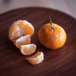 sliced oranges on brown wooden table