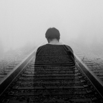 grayscale photo of man wearing black shirt