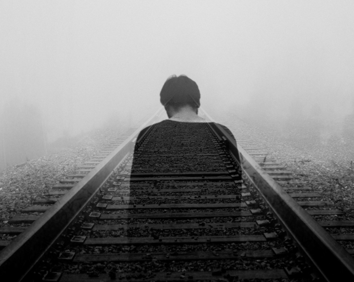 grayscale photo of man wearing black shirt