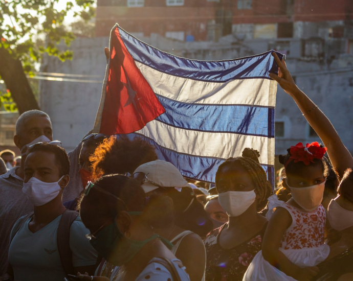 people holding flags during daytime