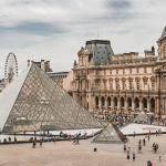 people gathering near Louvre Museum during daytime