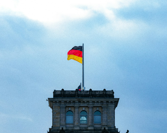 A tall building with a flag on top of it