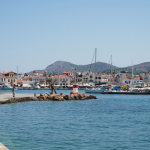 white and blue boat on sea during daytime