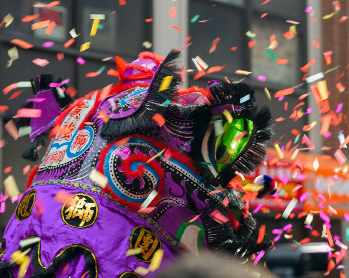 a colorful elephant is surrounded by confetti and streamers