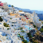 Breathtaking view of Santorini's iconic white and blue architecture against the Aegean Sea.