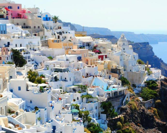 Breathtaking view of Santorini's iconic white and blue architecture against the Aegean Sea.