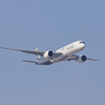 white airplane taking off during daytime