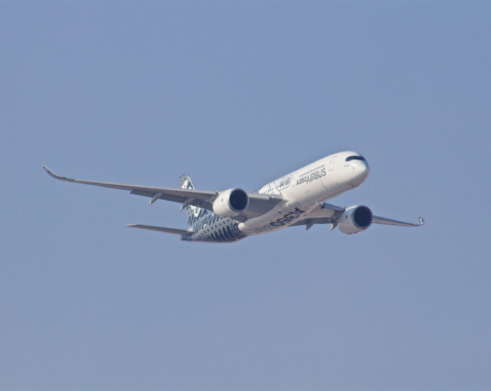 white airplane taking off during daytime