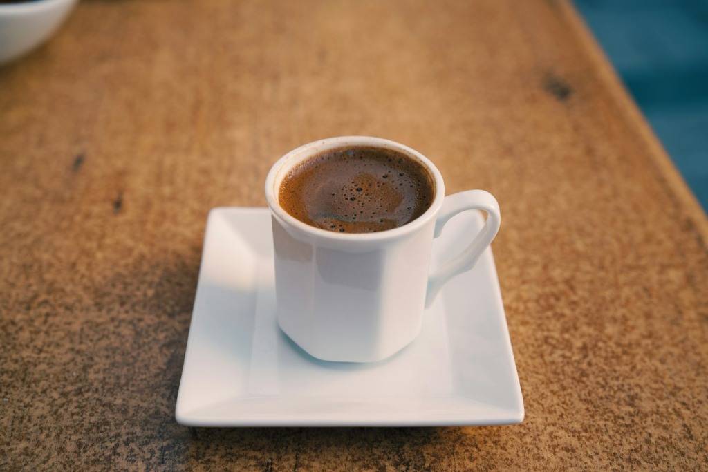 white ceramic mug on white ceramic saucer