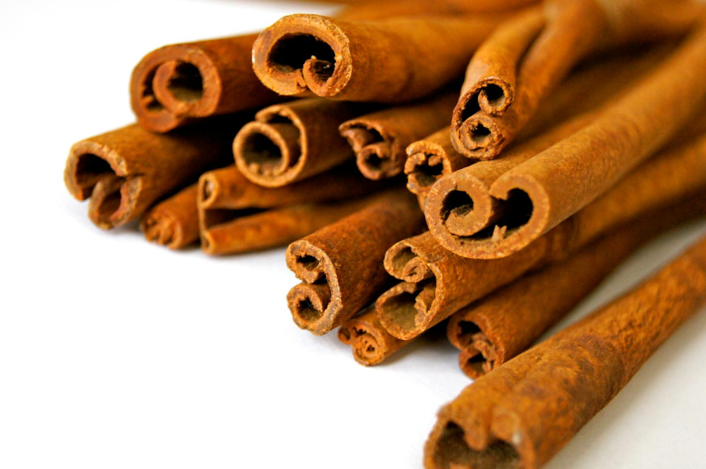 Aromatic cinnamon sticks displayed in a close-up view, capturing the texture and rich brown color.