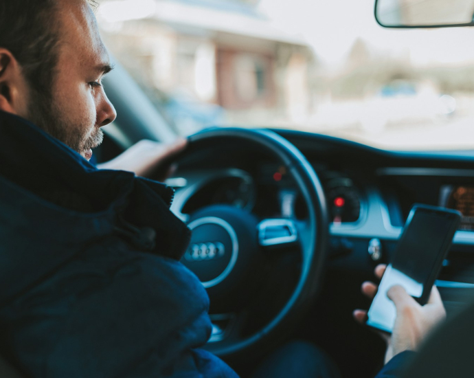 man holding black smartphone