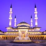 gold mosque during night time