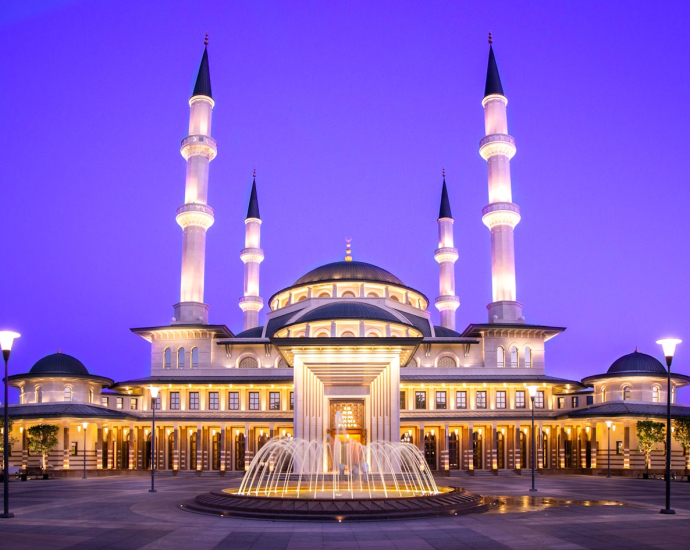 gold mosque during night time