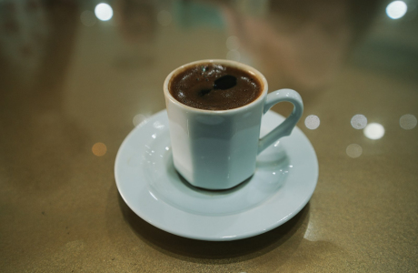 white ceramic mug on white ceramic saucer