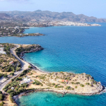 aerial view of green trees and blue sea during daytime