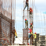 people working on building during daytime