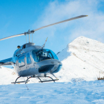 gray helicopter on mountain