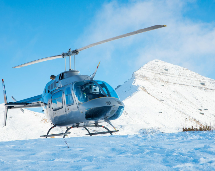 gray helicopter on mountain