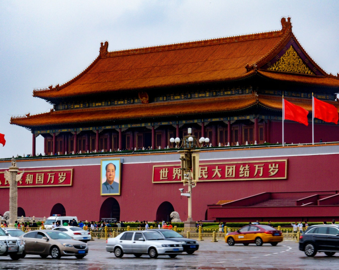 cars parked in front of red and brown building